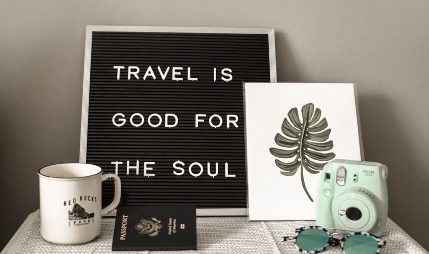 teal fujifilm instax mini camera near white ceramic mug